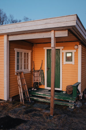yellow wooden cabin in a sunset lightの写真素材