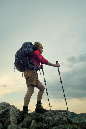 female hiker walking on a trail