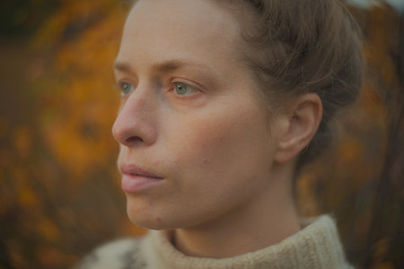 Natural beauty closeup portrait of a woman in knitted sweater