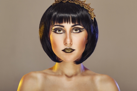 Close-up portrait of a beautiful girl with an evening make-up and jeweleryの写真素材