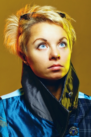 Portrait of a girl in a jacket with sunglasses on her headの写真素材