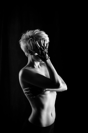 Attractive girl hides her face and breasts, shot in black and white versionの写真素材