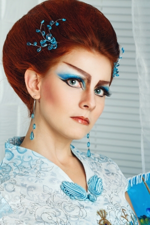Portrait of attractive girl with make-up Geisha, shot close-upの写真素材