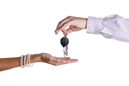 Transfer from the car ignition keys isolated on whiteの写真素材