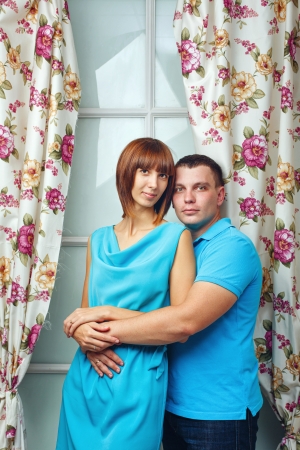 Man and woman embracing in a studio shotの写真素材