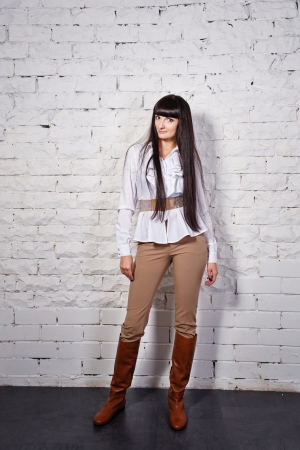 Attractive young brunette business woman in white blouseの写真素材