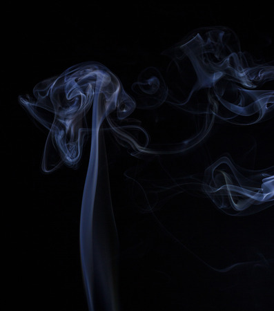 Abstract colored smoke closeup shot as the backdrop for the holidaysの写真素材