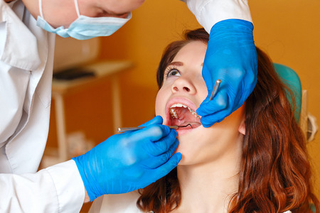Young girl on examination at the dentist in the dental clinic