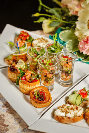 Restaurant food in the form of snacks, sandwiches and canapes closeup shotの写真素材