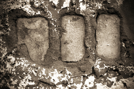 Grungy brickwork with cracks and chipped shot close-up, color tintingの写真素材
