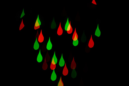 Multicolored abstract background of lights in the form of drops out of focusの写真素材