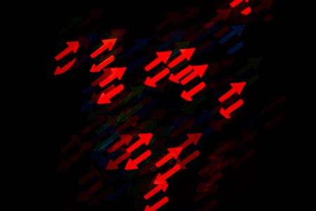 Multicolored abstract background of lights in the form of an arrow is not in focusの写真素材