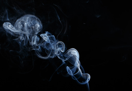 Abstract smoke moves on a black background
