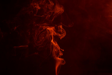 Abstract smoke moves on a black background