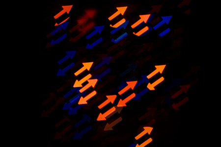 Multicolored abstract background of lights in the form of an arrow is not in focusの写真素材