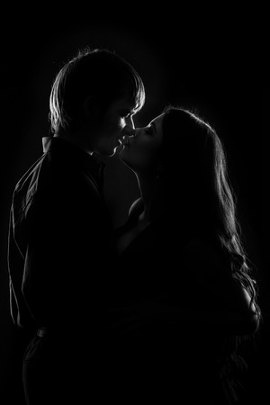 Young couple in love hugging each other, black and white photoの写真素材