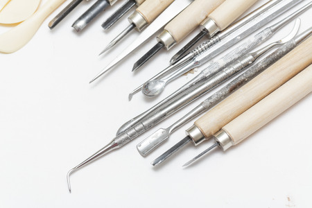 Professional tools and stacks, incisors of paint on paper backgroundの写真素材