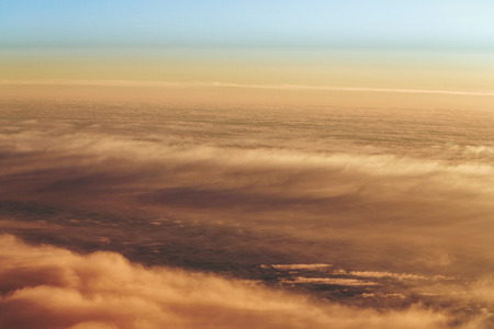 Sunset. Clouds from the altitude of the aircraft. Aerial view. Concept travel.の写真素材