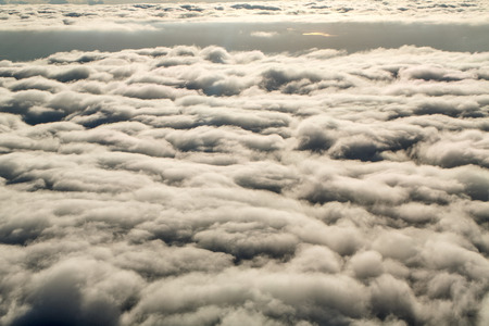 Airplane above the clouds. View of the clouds from the window. Concept travel.の写真素材
