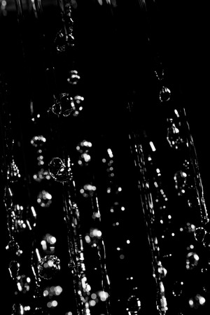Large drops of water on a black background. Texture. Design elements. The concept of rain.の写真素材