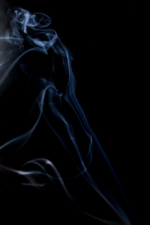 Abstract smoke on a black background. Texture. Design element. Abstract art. The smoke from the incense sticks. Macro shooting.の写真素材