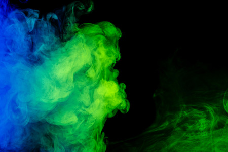 Abstract art. Colour blue-green smoke hookah on a black background. Background for Halloween. Texture fog. Design element. The concept of poison gas.の写真素材