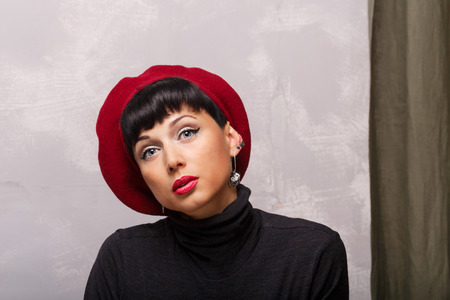 Portrait of a romantic French beret. The concept of French fashion.の写真素材