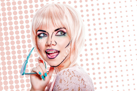 Girl with sunglasses and makeup in the style of pop art on a colored background. Attractive girl...
