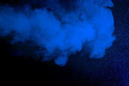 Abstract art. Blue hookah smoke and water drops on a black background. Inhalation. The steam...
