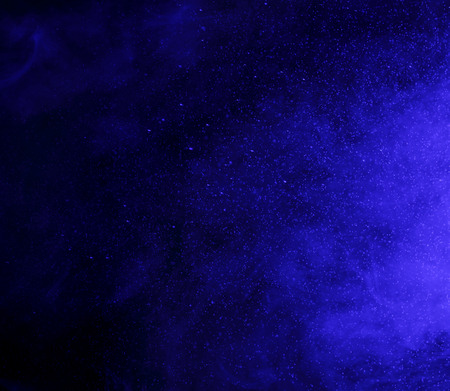 Abstract art. Blue hookah smoke and water drops on a black background. Inhalation. The steam...