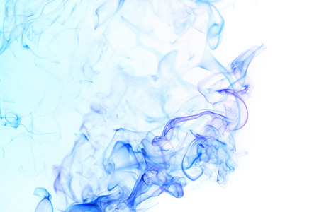 Abstract art. Blue smoke from the incense sticks on a white background. Background for Halloween. Texture fog. Design element. The concept of aromatherapy.の写真素材