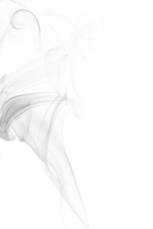 Abstract art. Grey smoke from the aromatic sticks on a white background. Background for Halloween. Texture fog. Design element. The concept of aromatherapy.の写真素材