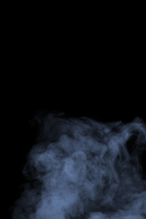 Abstract blue water vapor on a black background. Texture. Design elements. Abstract art. Steam the humidifier. Macro shot.の写真素材