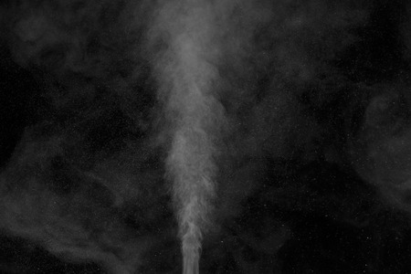 Abstract white water vapor on a black background. Texture. Design elements. Abstract art. Steam the humidifier. Macro shot.の写真素材