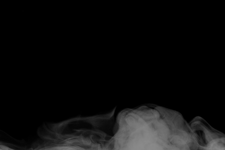 Abstract white water vapor on a black background. Texture. Design elements. Abstract art. Steam the humidifier. Macro shot.の写真素材
