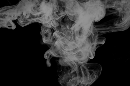 Abstract smoke Weipa. Personal vaporizers fragrant steam. The concept of alternative non-nicotine smoking. White smoke on a black background. E-cigarette. Evaporator. Taking Close-up. Vaping.の写真素材
