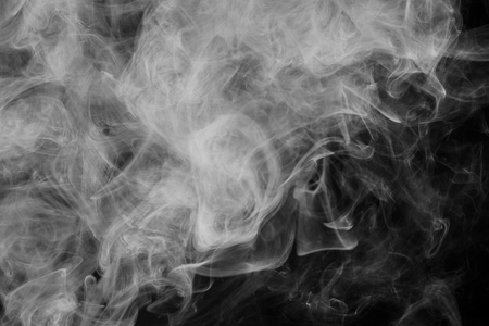 Abstract smoke Weipa. Personal vaporizers fragrant steam. The concept of alternative non-nicotine smoking. White smoke on a black background. E-cigarette. Evaporator. Taking Close-up. Vaping.の写真素材