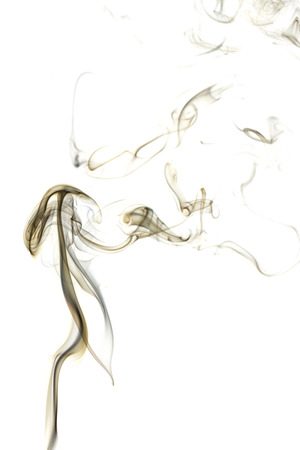 Abstract art. Brown smoke from the incense sticks on a white background. Background for Halloween. Texture fog. Design element. The concept of aromatherapy.の写真素材