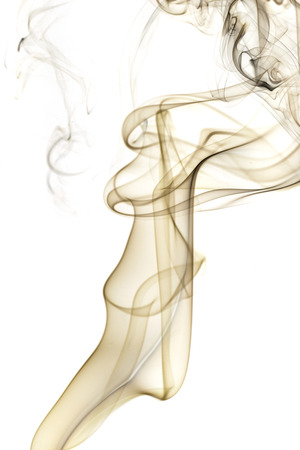 Abstract art. Brown smoke from the incense sticks on a white background. Background for Halloween. Texture fog. Design element. The concept of aromatherapy.の写真素材