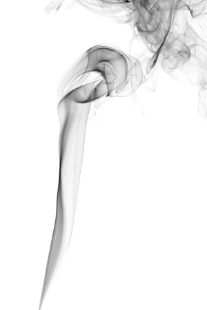 Abstract art. Gray smoke from the aromatic sticks on a white background. Background for Halloween. Texture fog. Design element. The concept of aromatherapy.の写真素材
