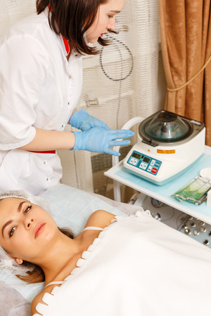 Plazmolifting in a beauty salon. Machine cosmetology. Spa. Skin rejuvenation.の写真素材
