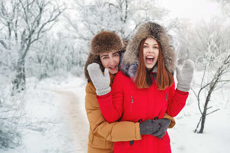 Couple in love. Teenagers on a date outdoors in the winter. The joy of meeting.の写真素材