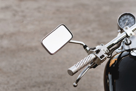 Motorcycle steering close-up. Speedometer, gas tank and brake handle in frame.の写真素材