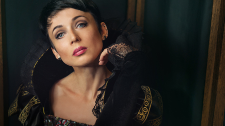 Attractive girl in retro baroque style dress. Old fashion style.