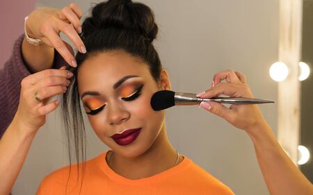 Open workshop hairdressing. Master class makeup art shows on model. Fashion professional. Practice...