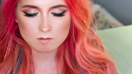 Beauty fashion model girl creative art makeup. Closed eyes. Holiday Make up. Trendy color modern stylish hairstyle. Ombre with pink hair. Beauty industryの写真素材