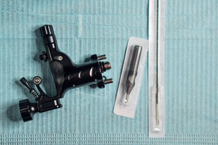 Professional tattoo machine. Gun. Background. Space for textの写真素材