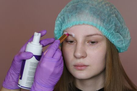 Wash, cleanse and disinfect eyebrows before correction and dyeing. Asepsis rules. Cosmetic procedure...