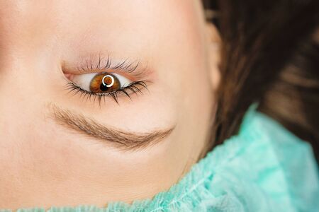 Woman after cosmetological procedure. Female eye with long eyelashes. Eyelash extensions,...