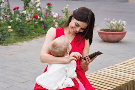 Working mom on maternity leave. Mompreneur. Mom in beautiful style. Female happiness. Busy working...